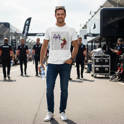 Male grand prix fan in a paddock wearing The Magic Number Lewis Hamilton T-Shirt with the purple 44 graffiti print, styled with jeans and sunglasses on a race day.
