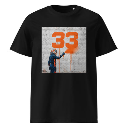 Black organic cotton F1 t-shirt with Max 33 graffiti art design, featuring Max Verstappen spray painting the number 33 in orange on a brick wall. Perfect for Max Verstappen fans and Red Bull Racing supporters.
