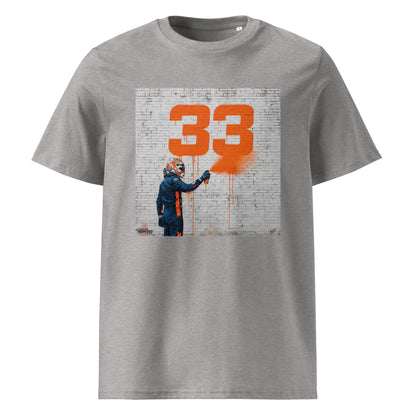 Heather Grey organic cotton F1 t-shirt with Max 33 graffiti art design, featuring Max Verstappen spray painting the number 33 in orange on a brick wall. Perfect for Max Verstappen fans and Red Bull Racing supporters.