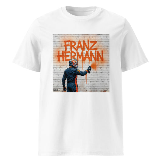 White unisex t-shirt featuring graffiti art of Max Verstappen’s alter ego Franz Hermann spray-painting his name on a brick wall, part of TheTeeShop’s Max Series graffiti art collection.