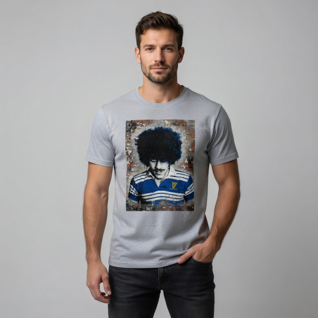 Male model in a Leinster rugby t-shirt with Phil Lynott Rock Poet retro Leinster jersey artwork on a red brick wall.