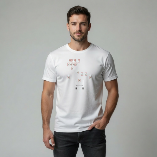 Man wearing a white Ulster t-shirt with a graphic design on a plain background