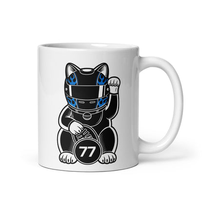 Motorsport-inspired lucky cat mug with black kit, blue flame helmet styling, and #77 coin detail perfect for race mornings and desk flex energy.