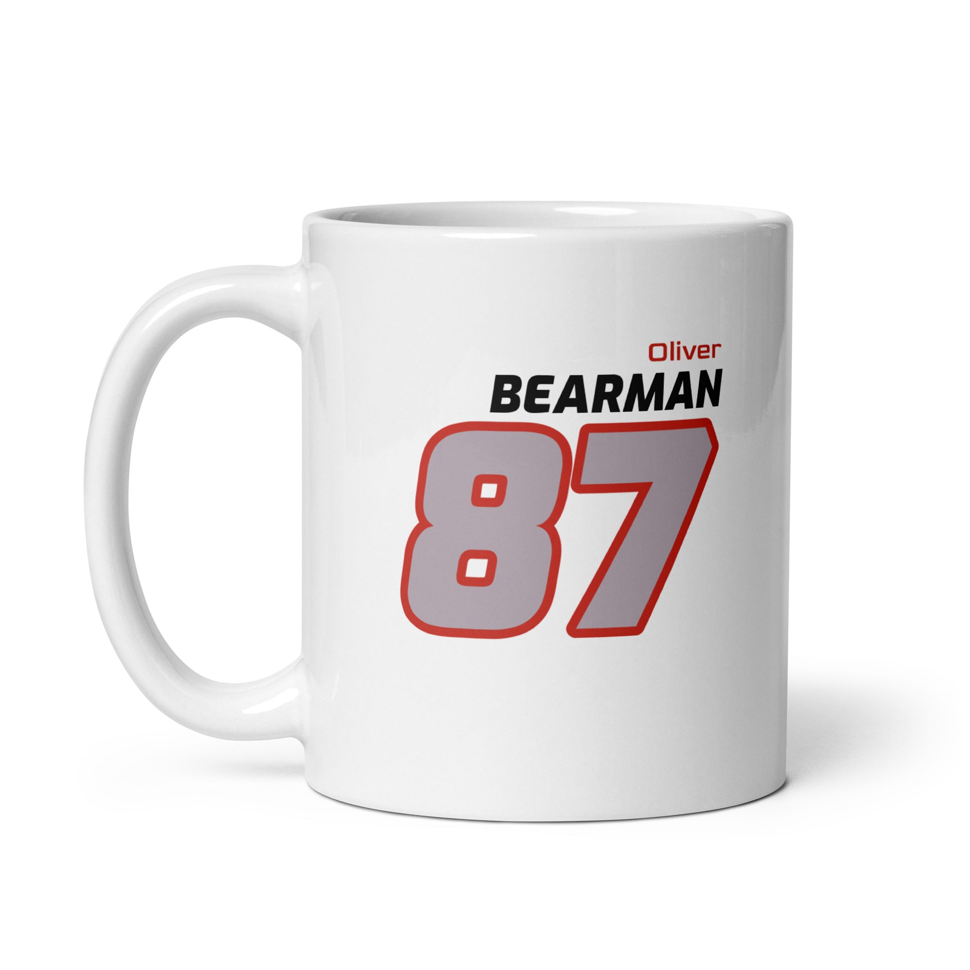 View of the Oliver Bearman Racing Mug from the left handle side, featuring his name and number in Haas's team colours. Great for gifts and collections.