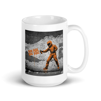 White ceramic 15oz mug featuring a street art illustration of a racing driver in a papaya suit spray-painting “BOX BOX BOX BOX!” in orange on a distressed brick wall, inspired by McLaren F1 pit stops.