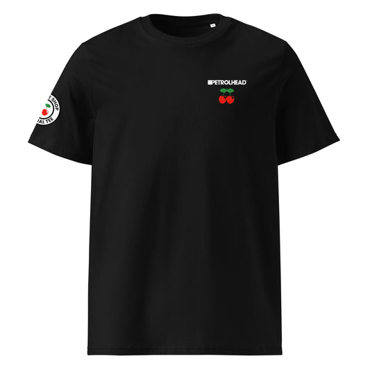 Front view of black unisex t-shirt with small white PETROLHEAD™ slogan and mini red cherries graphic on the left chest. DTF print, subtle car meet and club culture style.