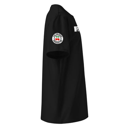 Right side view of black t-shirt showing The Tee Shop’s exclusive two-cherry logo patch on the sleeve and part of the bold PETROLHEAD™ front print. DTF print, car culture meets club style.
