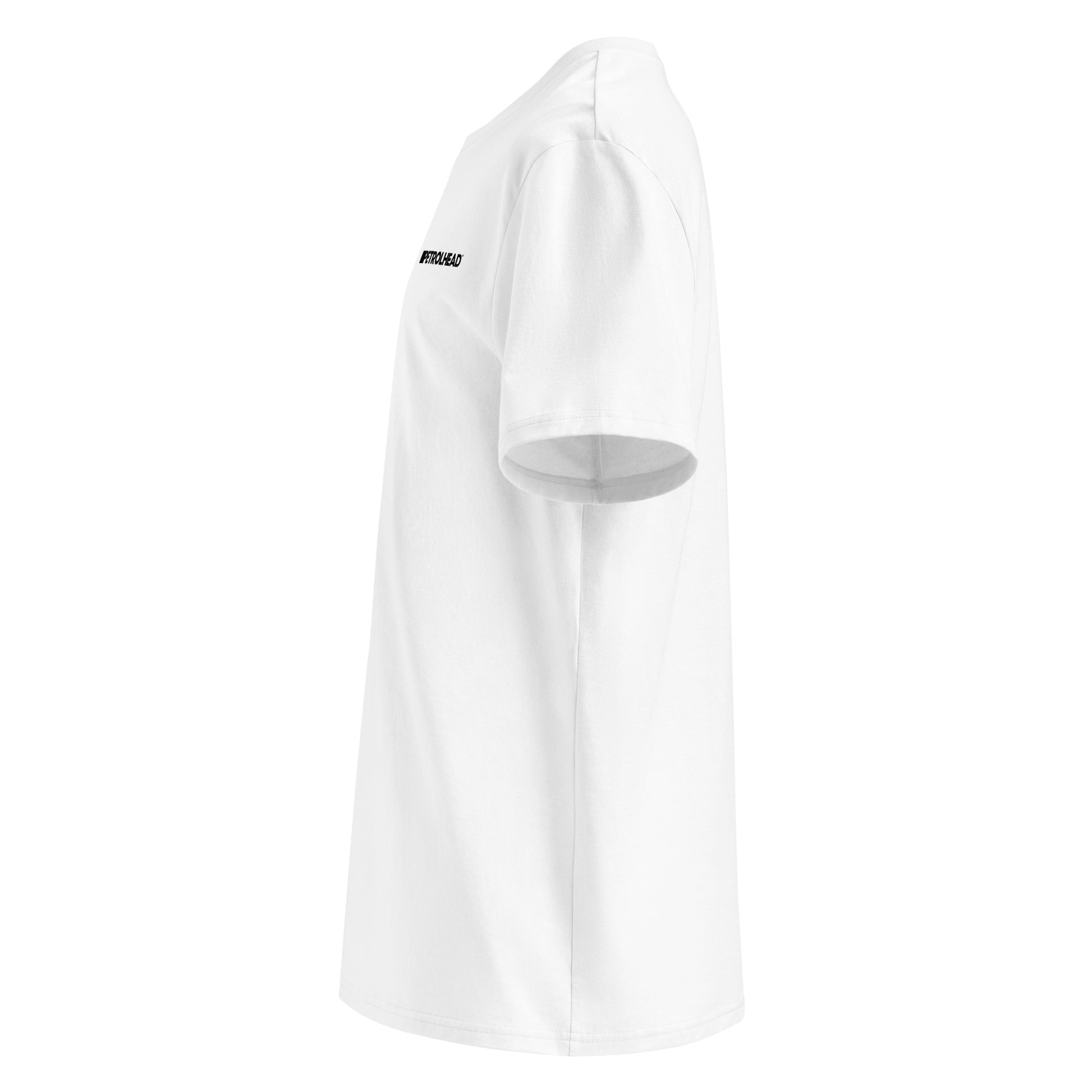 Left side view of white unisex t-shirt, plain sleeve, visible side of the small PETROLHEAD™ logo. Minimalist, understated car meet style.
