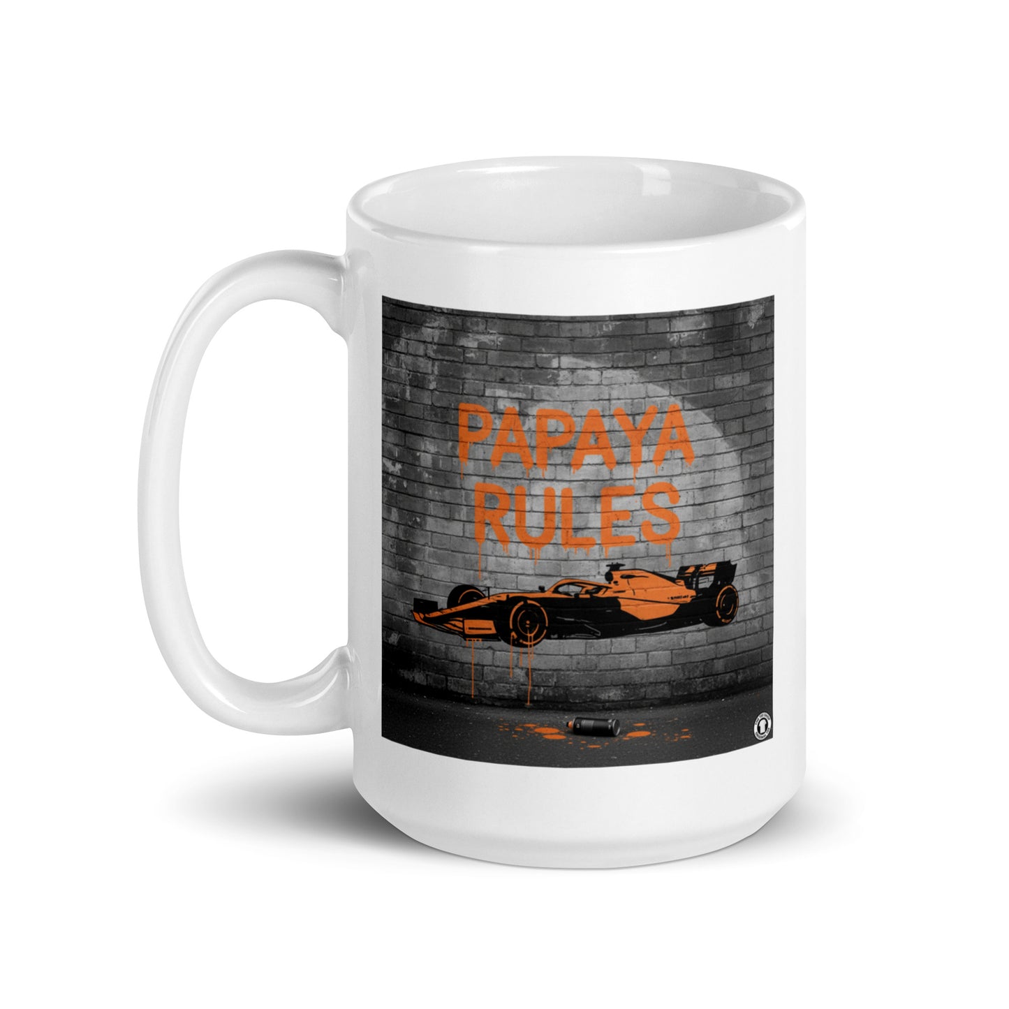 White ceramic 15oz mug featuring a street art illustration of a papaya orange McLaren F1 car and “PAPAYA RULES” graffiti on a dark brick wall.