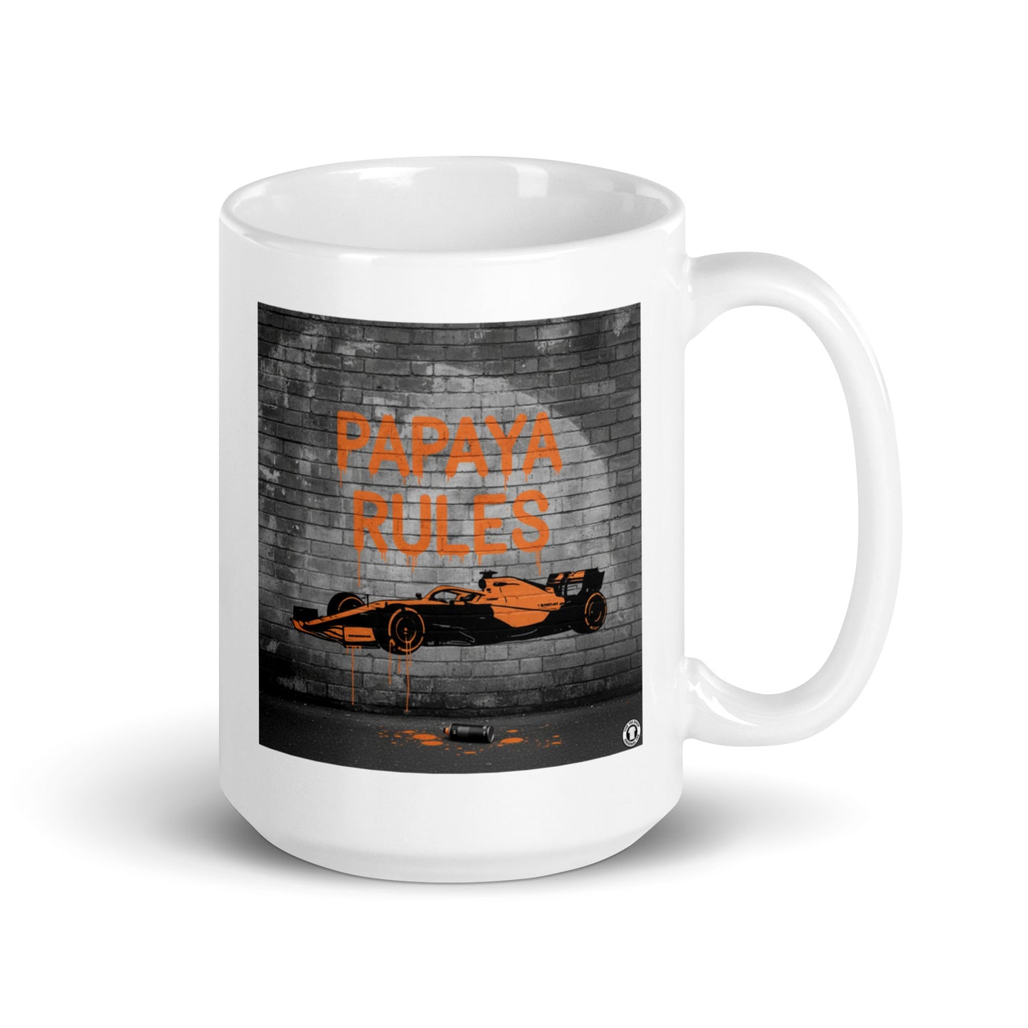 White ceramic 15oz mug featuring a street art illustration of a papaya orange McLaren F1 car and “PAPAYA RULES” graffiti on a dark brick wall.