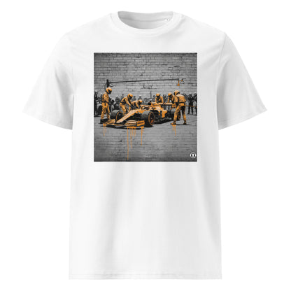 White unisex t-shirt featuring a street art graffiti design of a McLaren-inspired pit stop scene with bold papaya orange accents, part of TheTeeShop’s Papaya Series in the Paddock Collection.