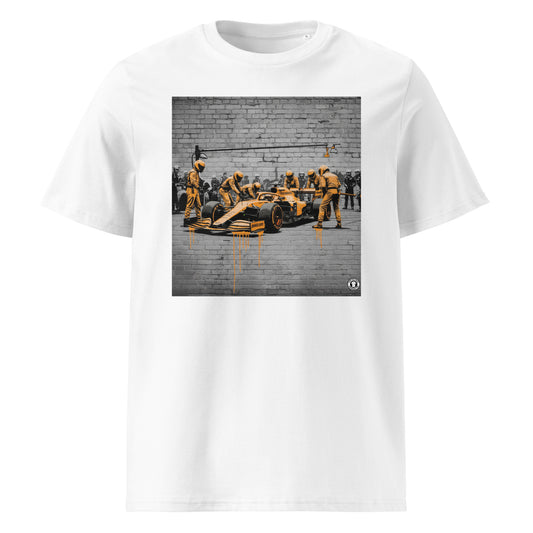 White unisex t-shirt featuring a street art graffiti design of a McLaren-inspired pit stop scene with bold papaya orange accents, part of TheTeeShop’s Papaya Series in the Paddock Collection.