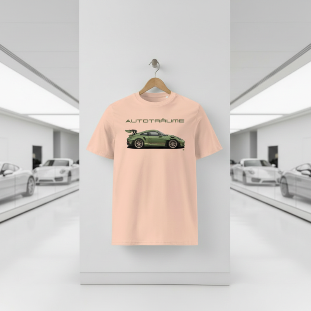 Peach AUTOTRÄUME GT3 T‑shirt with an olive green Porsche‑style car illustration hanging on a premium wooden hanger and silver peg against a central white wall in a bright sports car gallery, with a glossy white floor and blurred white and silver sports cars running down both sides.