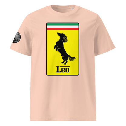 Product photo of the Prancing Leo T-Shirt in fraiche peche, featuring a bold yellow badge with a black silhouette of a longhaired dachshund and “Leo” text, inspired by Italian motorsport and perfect for racing and dog lovers.