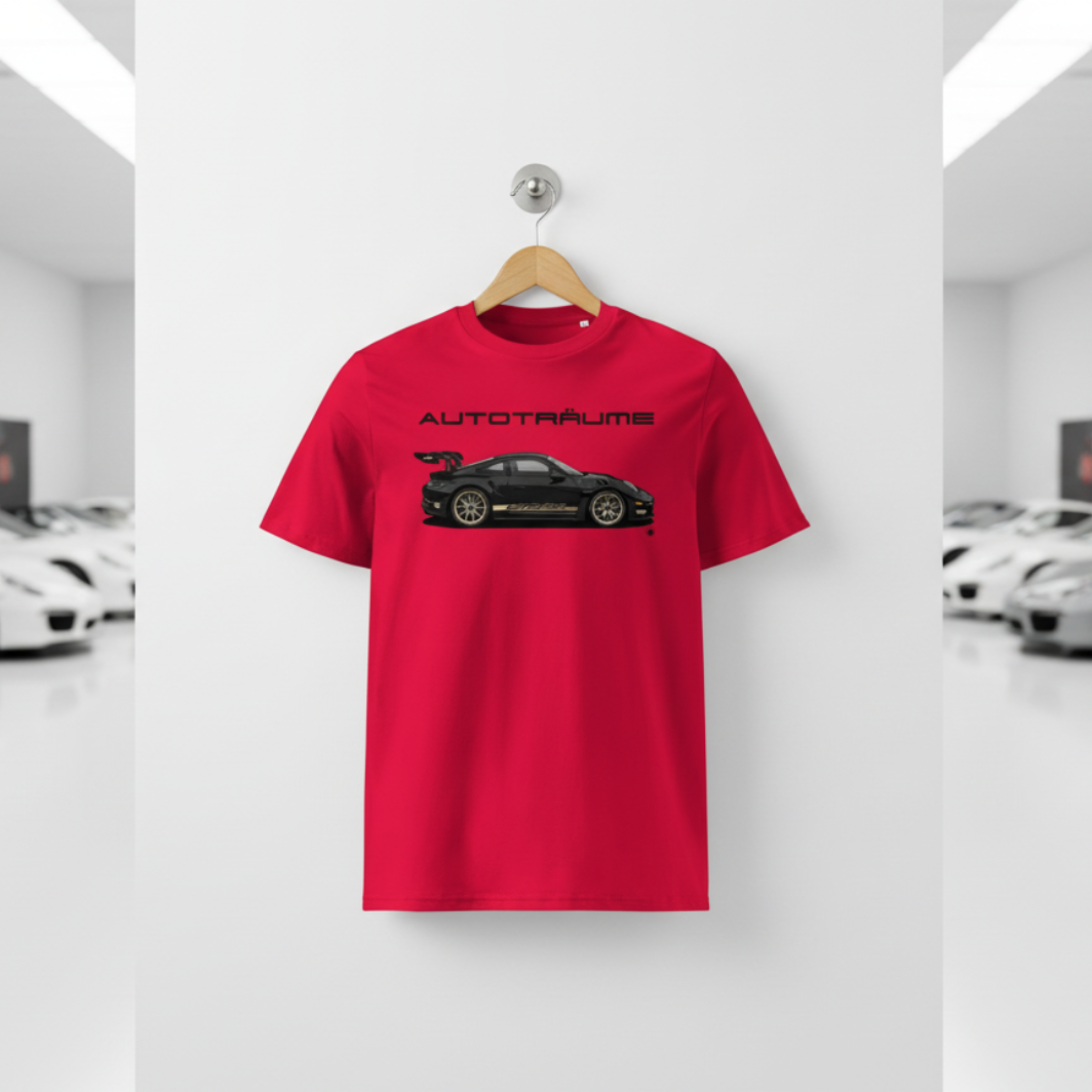 Red AUTOTRÄUME GT3 T‑shirt with a black Porsche‑style car and gold highlights illustration hanging on a premium wooden hanger and silver wall peg against a central white wall in a bright sports car gallery, with a glossy white floor and blurred white and silver sports cars running down both sides.