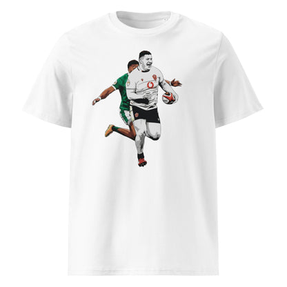 White rugby t-shirt featuring Rhys Carré running with the ball for Wales as one Irish defender chases behind.