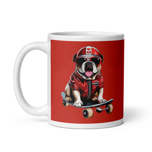 White ceramic 11oz mug with a bold red background featuring a playful illustration of Roscoe, a bulldog in Ferrari red jacket, sunglasses, and a racing helmet with the number 44, riding a skateboard, inspired by Lewis Hamilton’s famous F1 dog.