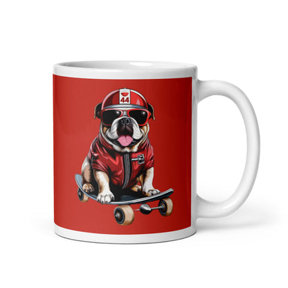 White ceramic 11oz mug with a bold red background featuring a playful illustration of Roscoe, a bulldog in a red jacket, sunglasses, and a racing helmet, riding a skateboard, inspired by fast dogs.