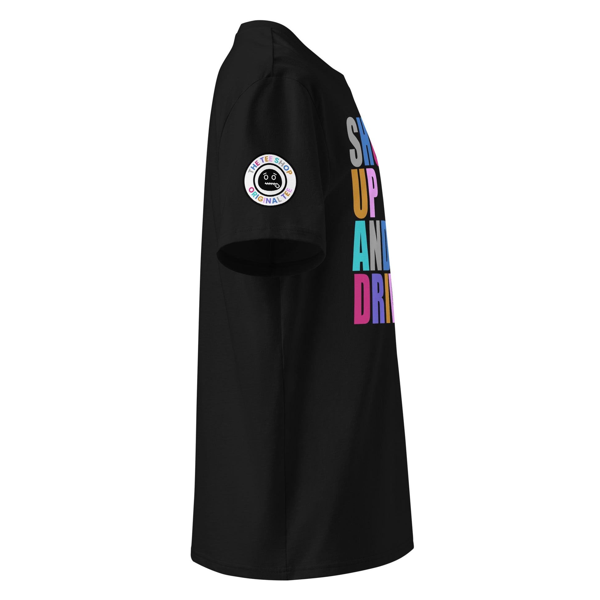 Right side view of black t-shirt showing The Tee Shop’s unique zip it logo on the sleeve and edge of the multi-colour “SHUT UP AND DRIVE” front print. DTF print, car meet banter style.