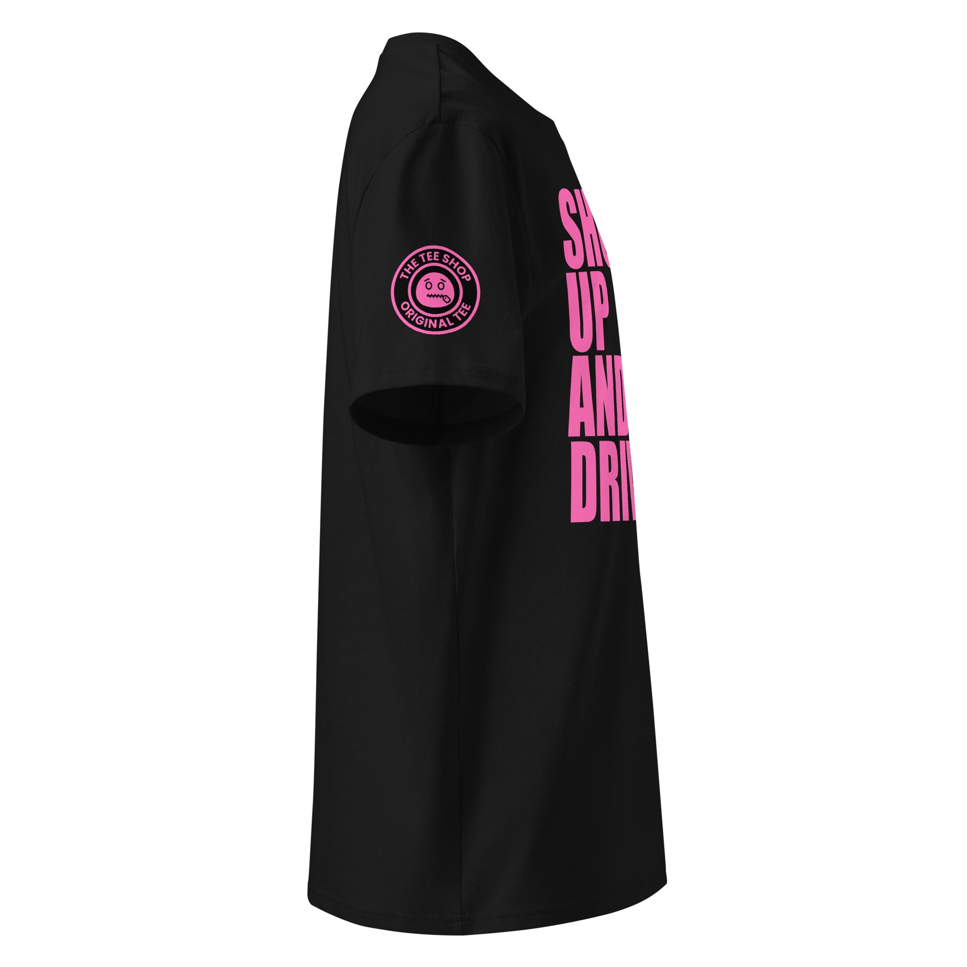Right side view of black t-shirt showing The Tee Shop’s unique zip it logo on the sleeve and edge of the pink “SHUT UP AND DRIVE” front print. DTF print, car meet banter style.