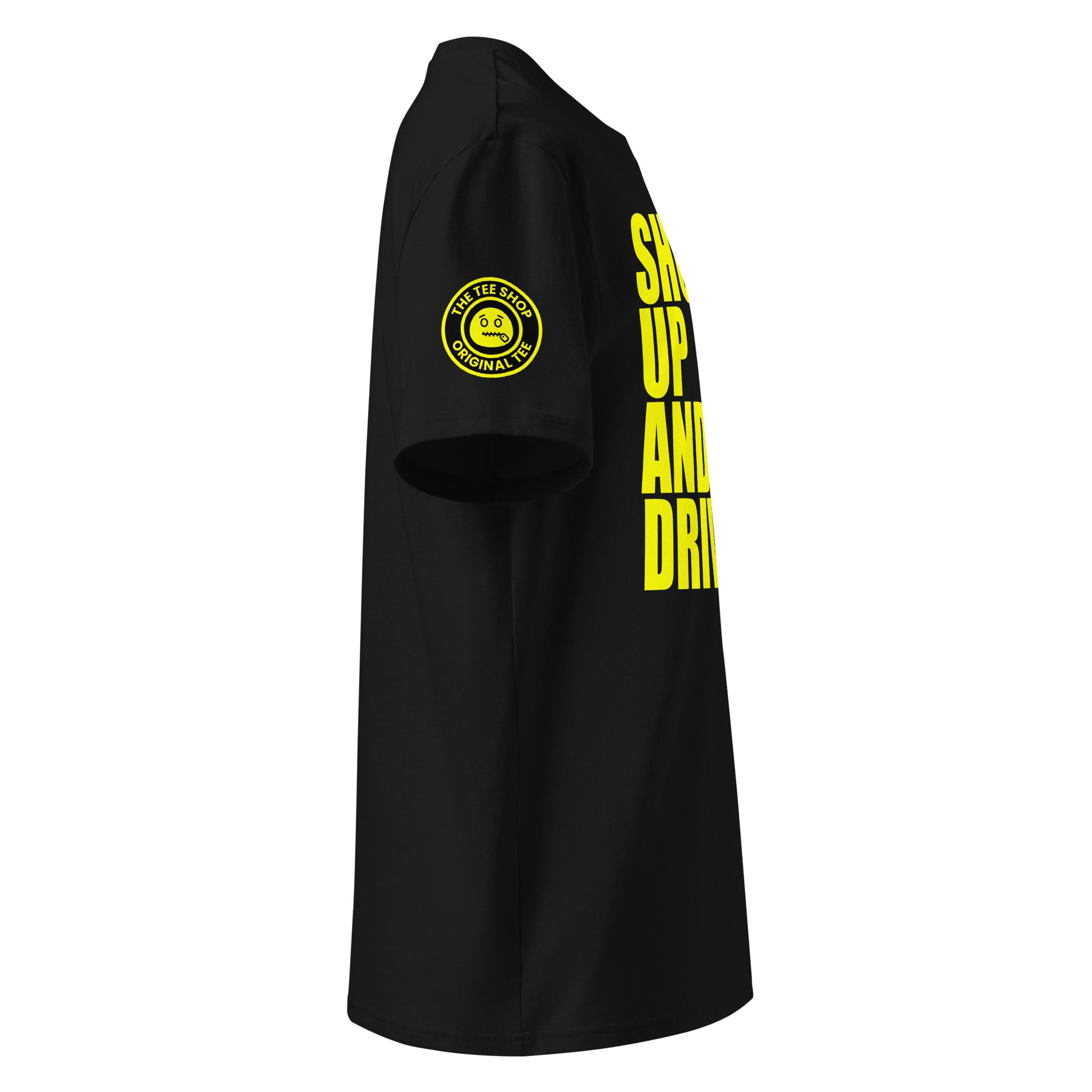 Right side view of black t-shirt showing The Tee Shop’s unique zip it logo on the sleeve and edge of the yellow “SHUT UP AND DRIVE” front print. DTF print, car meet banter style.