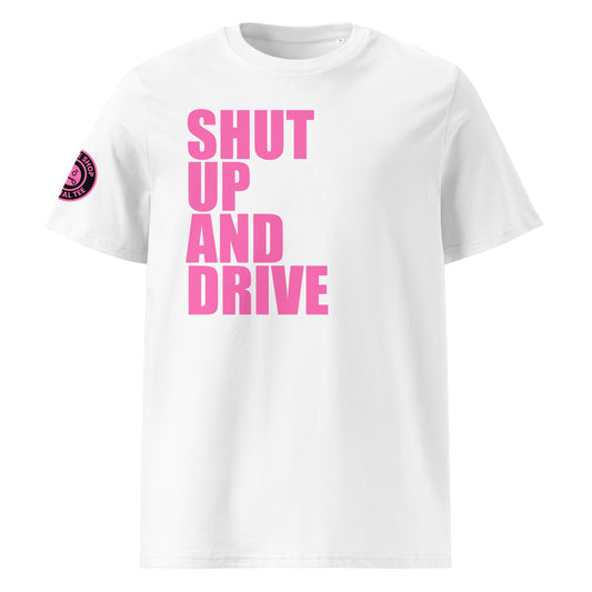 Front view of white unisex t-shirt with bold pink “SHUT UP AND DRIVE” slogan in large font across the chest. DTF print, perfect for car meet fans and driving enthusiasts.