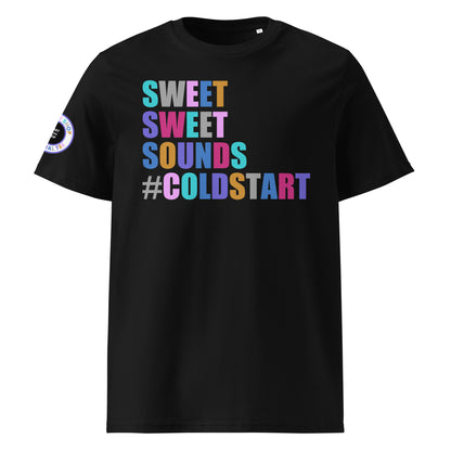 Front view of black unisex t-shirt with “SWEET SWEET SOUNDS #COLDSTART” slogan in multi-colour harlequin print. DTF print, perfect for cold start fans and car meet culture.