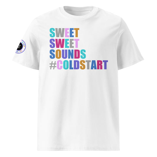 Front view of white unisex t-shirt with “SWEET SWEET SOUNDS #COLDSTART” slogan in multi-colour harlequin print. DTF print, perfect for cold start fans and car meet culture.