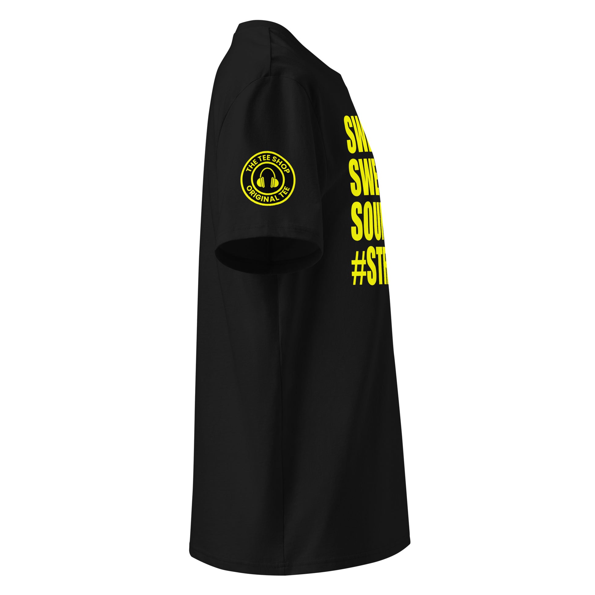 Right side view of black t-shirt showing The Tee Shop’s unique ear muffs logo on the sleeve and edge of the yellow SWEET SWEET SOUNDS #STRAIGHTSIX slogan. DTF print, car culture and engine tribute.