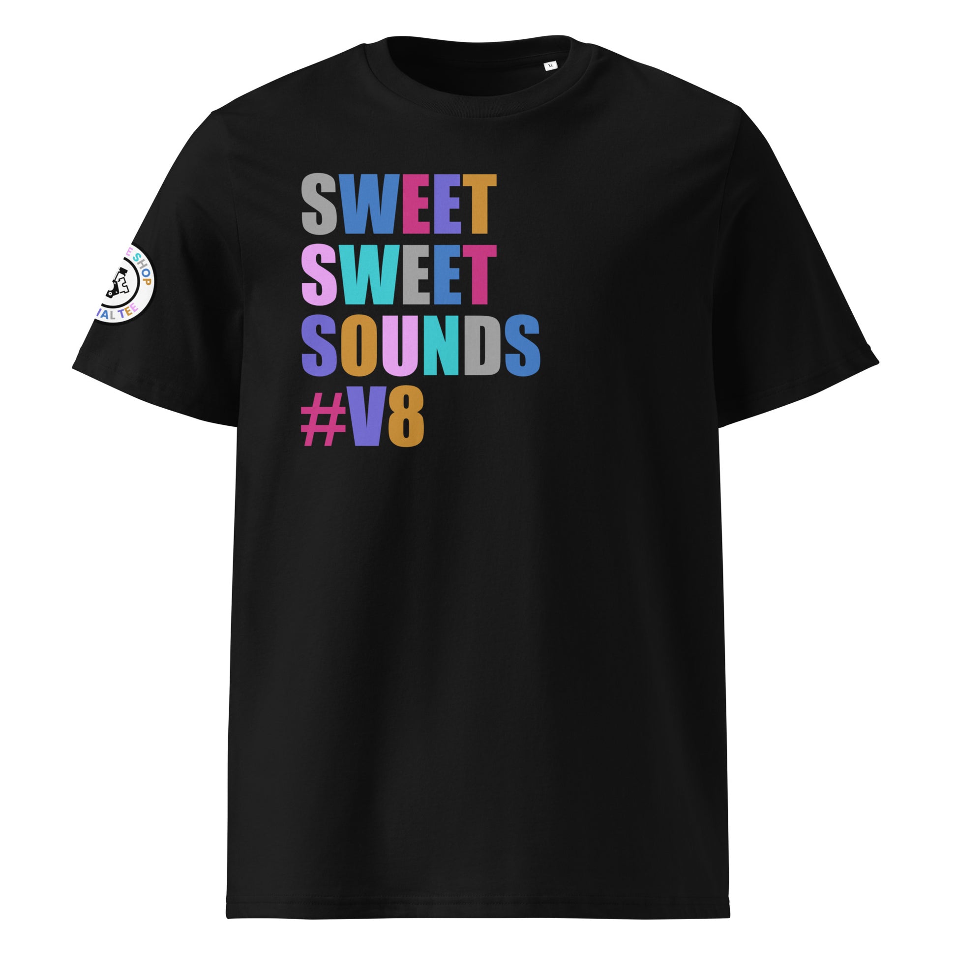 Front view of black unisex t-shirt with “SWEET SWEET SOUNDS #V8” slogan in multi-colour harlequin print. DTF print, perfect for V8 engine fans and car meet enthusiasts.
