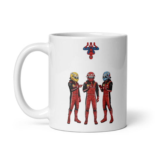 White ceramic 11oz mug featuring a playful illustration of three Ferrari F1 drivers in red race suits and helmets, all pointing at each other in the Spider-Man meme pose, with Spider-Man hanging upside down above them.