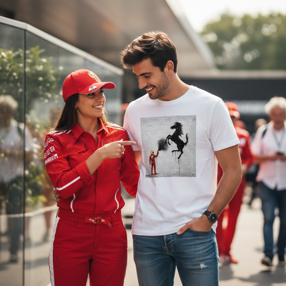 Smiling man wearing TheTeeShop’s Scuderia Series Prancing Horse Graffiti T-Shirt being pointed at by a Ferrari fan in full team uniform at a Formula 1 paddock, highlighting bold Ferrari-inspired streetwear and team pride.