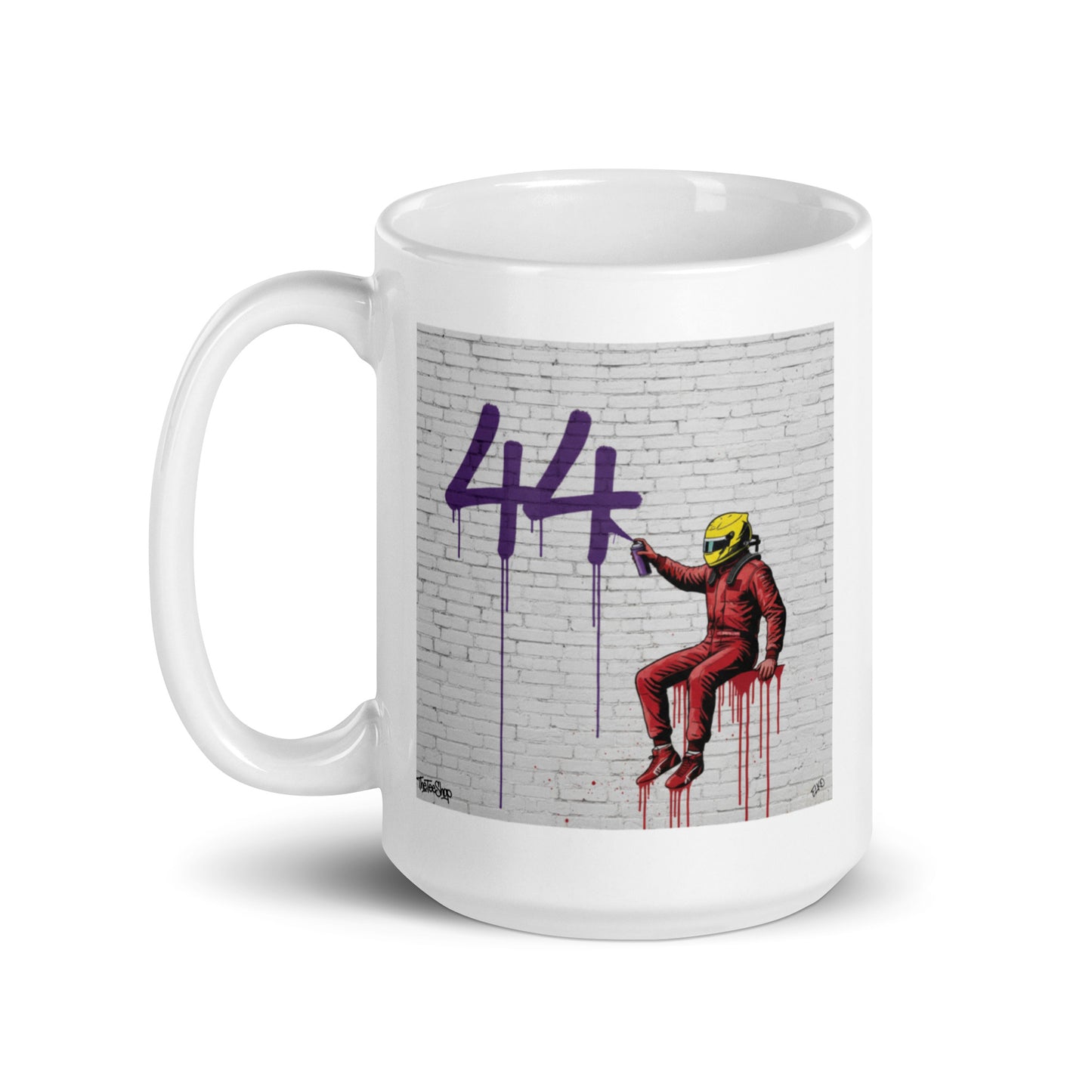 White ceramic 15 oz mug featuring a street art illustration of a racing driver in Ferrari red overalls and a yellow helmet spray-painting a large purple 44 on a white brick wall, inspired by Lewis Hamilton and Ferrari.