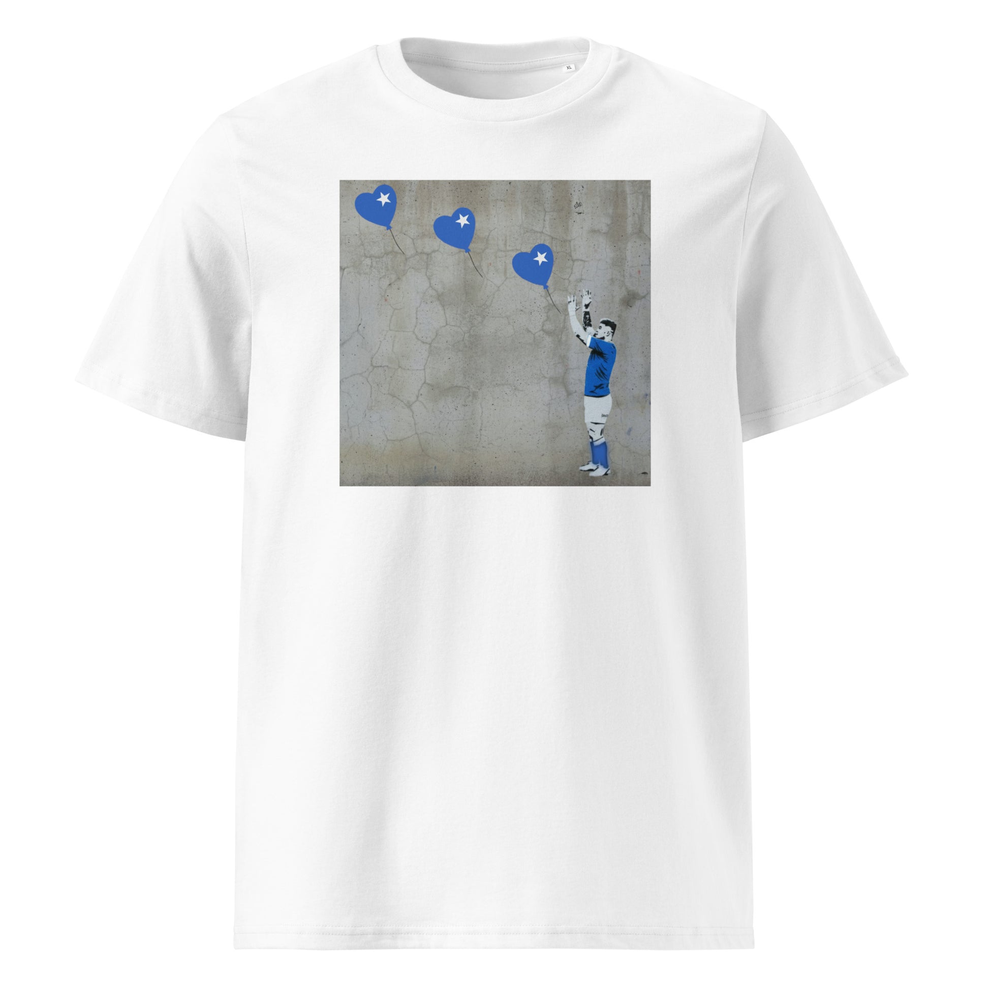White unisex organic cotton t‑shirt with street-art style print of a St Mary’s RFC rugby player reaching up to three blue heart balloons with white star details.