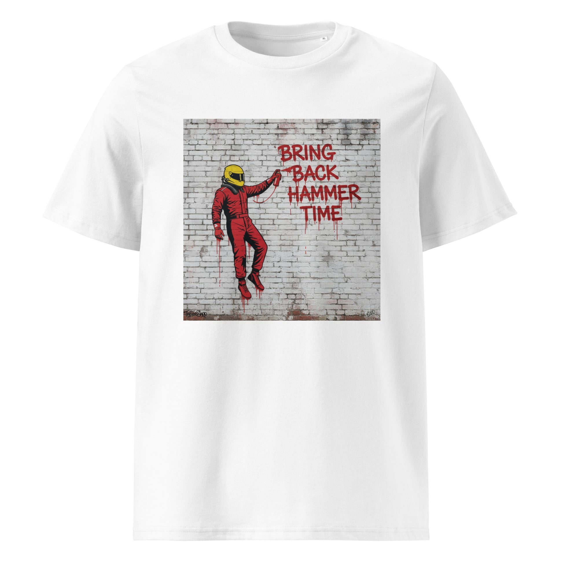 White unisex t-shirt featuring graffiti art of a racing driver in a red suit spray-painting “BRING BACK HAMMER TIME” on a brick wall, part of TheTeeShop’s Suderia Series collection.