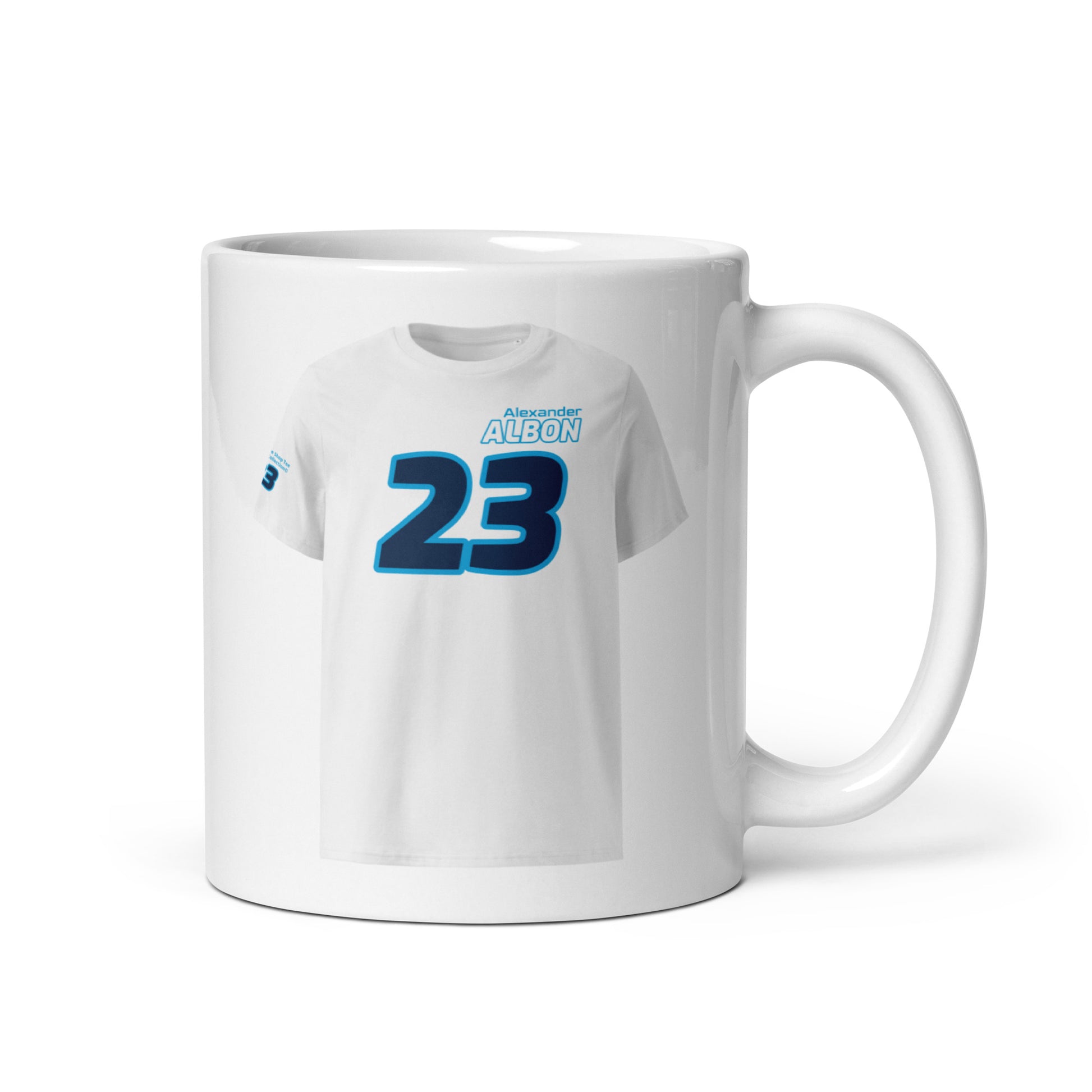 A white ceramic TeeMug© featuring a Williams team colors design with "Alexander Albon" in bold letters and the number "23". The mug is shown with the handle on the right side.