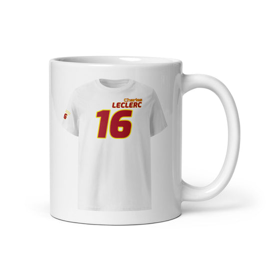 A white ceramic TeeMug© featuring a Scuderia Ferrari red and yellow design with "Charles LECLERC" in bold letters and the number "16". The mug is held by a handle on the right side.