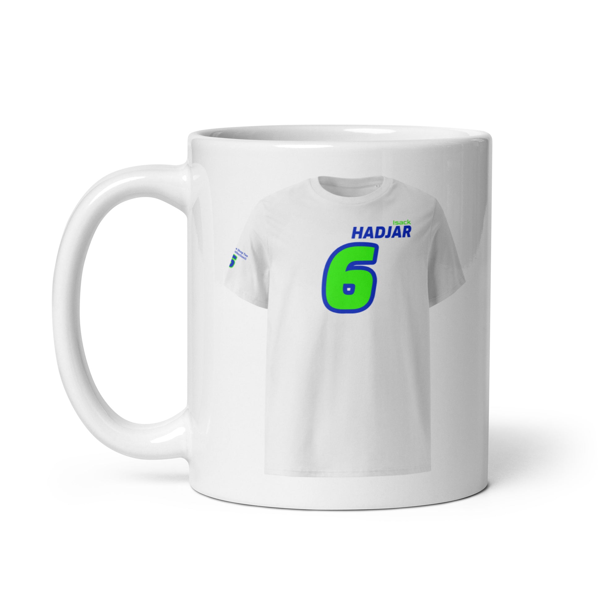 A white ceramic TeeMug© featuring a blue and green design with "HADJAR" in bold letters and the number "6". The mug is shown with the handle on the left side.