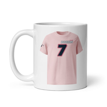 A white ceramic TeeMug© featuring an Alpine pink and blue design with "DOOHAN" in bold letters and the number "7". The mug is held by a handle on the left side.