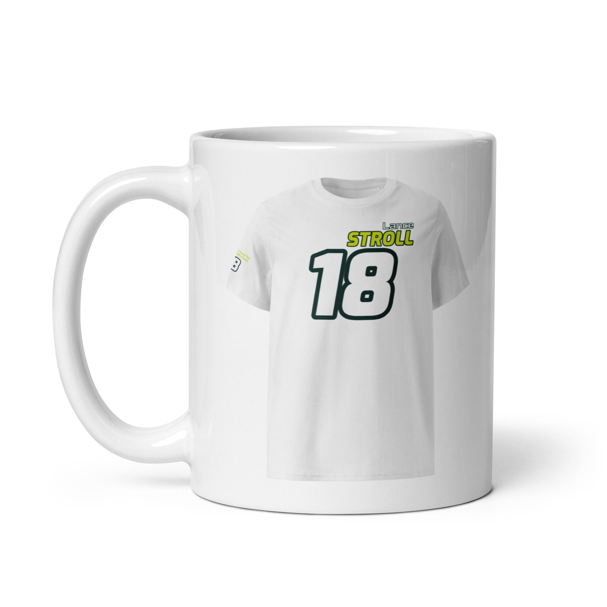 A white ceramic TeeMug© featuring a green and yellow design with "Lance STROLL" in bold letters and the number "18". The mug is held by a handle on the left side.
