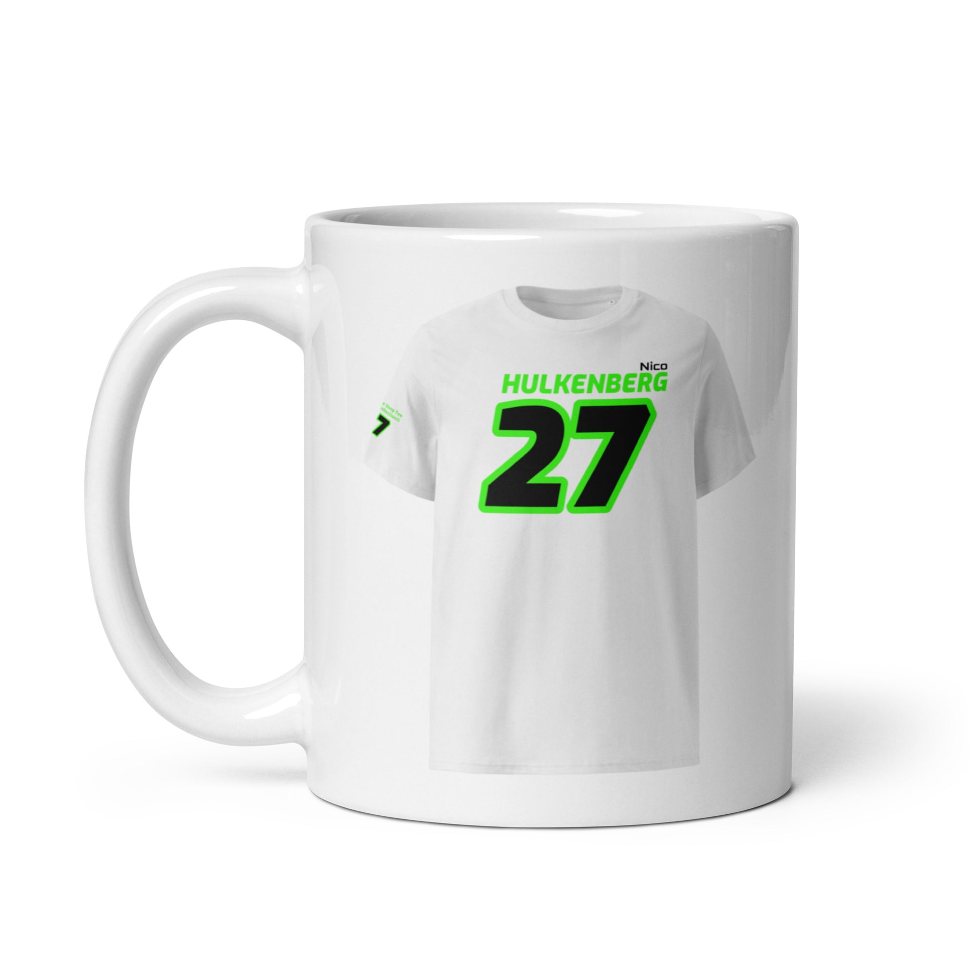A white ceramic TeeMug© featuring a green and black design with "Nico HULKENBERG" in bold letters and the number "27". The mug is shown with the handle on the left side.