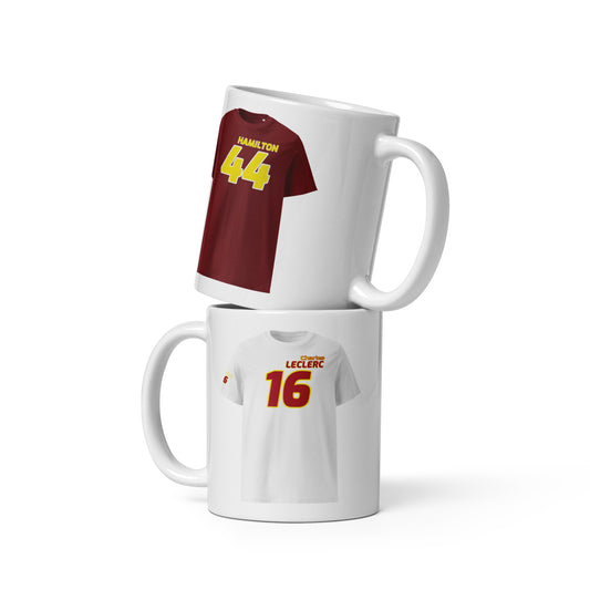 The Teemug© featuring racing legends Lewis Hamilton and Charles Leclerc. The mug showcases their names and numbers in striking colours, with Hamilton's maroon and yellow and Leclerc's white and yellow designs. Perfect for motorsport fans and collectors.