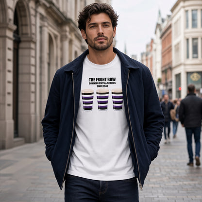 Male model wearing a white Terenure rugby t-shirt reading “The Front Row -Downing Pints & Scrums Since 1940” with three purple, black and white pint graphics, photographed outdoors IN Grafton Street for Leinster match day supporters