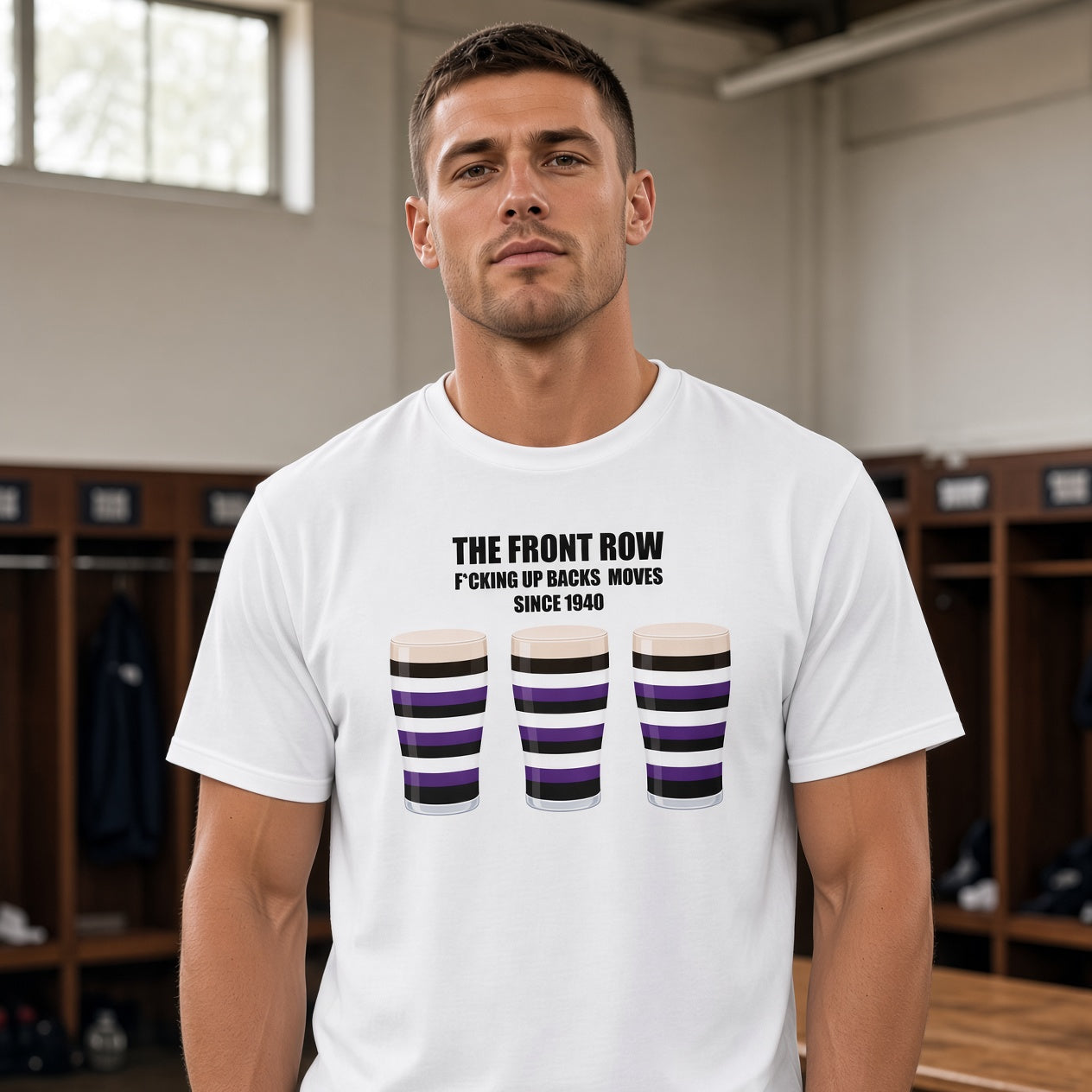 Male model wearing a white Terenure rugby t-shirt reading “The Front Row - F*cking Up Back Moves Since 1940” with three purple, black and white pint graphics, photographed in a rugby changing room setting