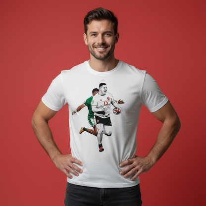 Man wearing a Welsh rugby t-shirt featuring Rhys Carré running. The model has his hand on his hips on a red background.