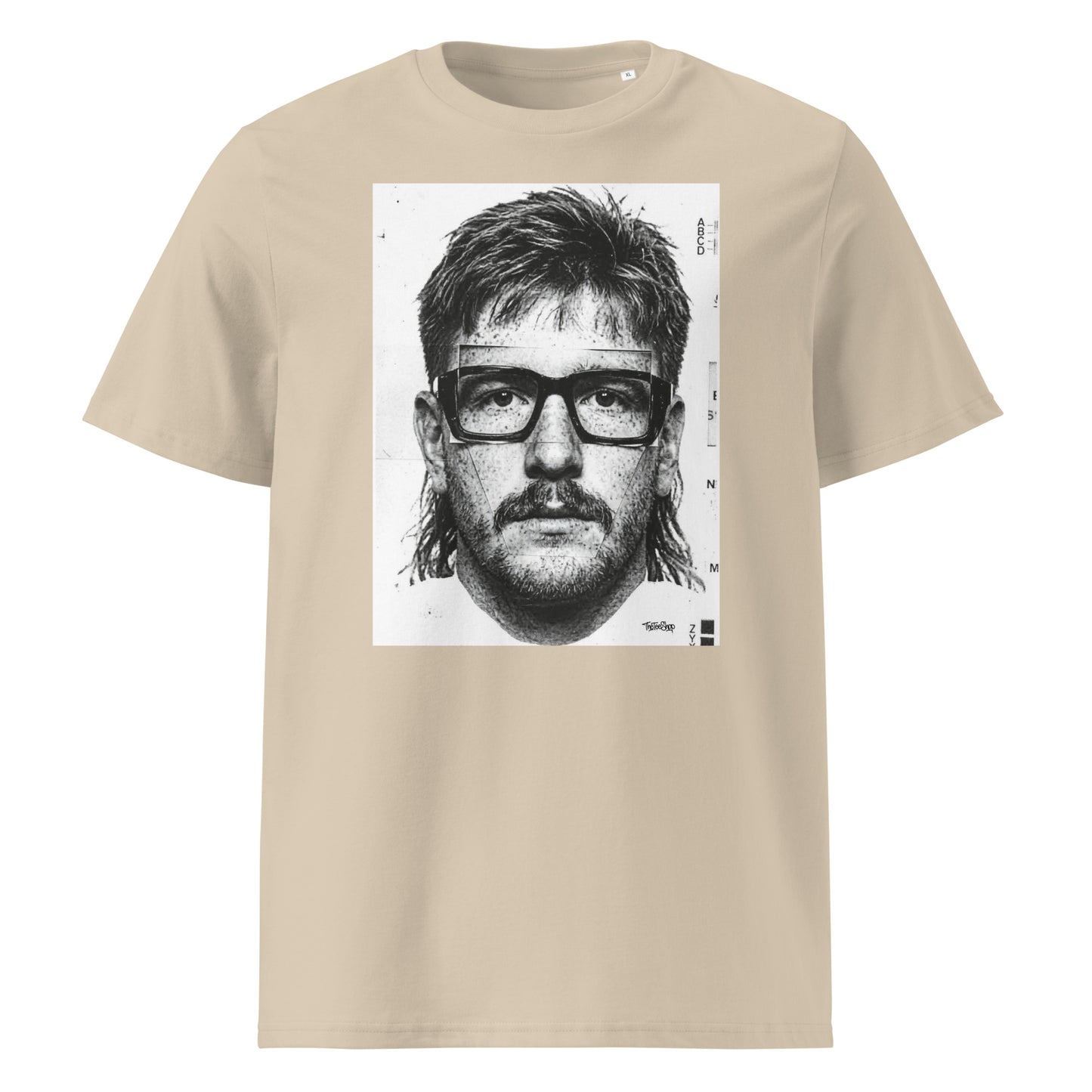 Desert dust t-shirt front view featuring an illustrated portrait inspired by a modern rugby lock wearing black glasses with a “what you looking at?” expression