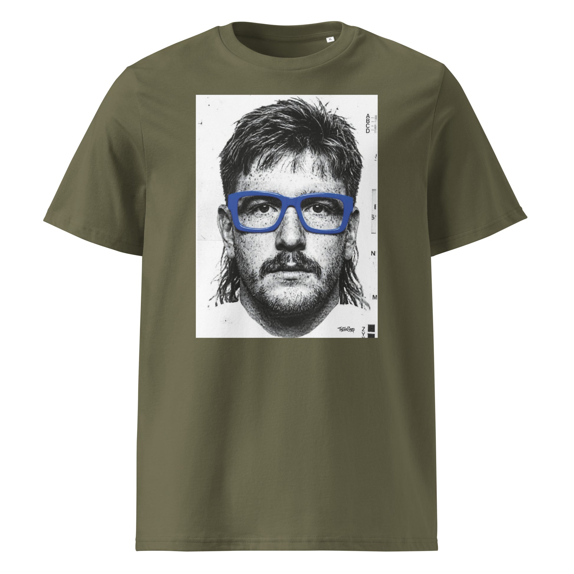 Khaki t-shirt front view featuring an illustrated portrait inspired by a modern rugby lock wearing bold blue glasses with a “what you looking at?” expression