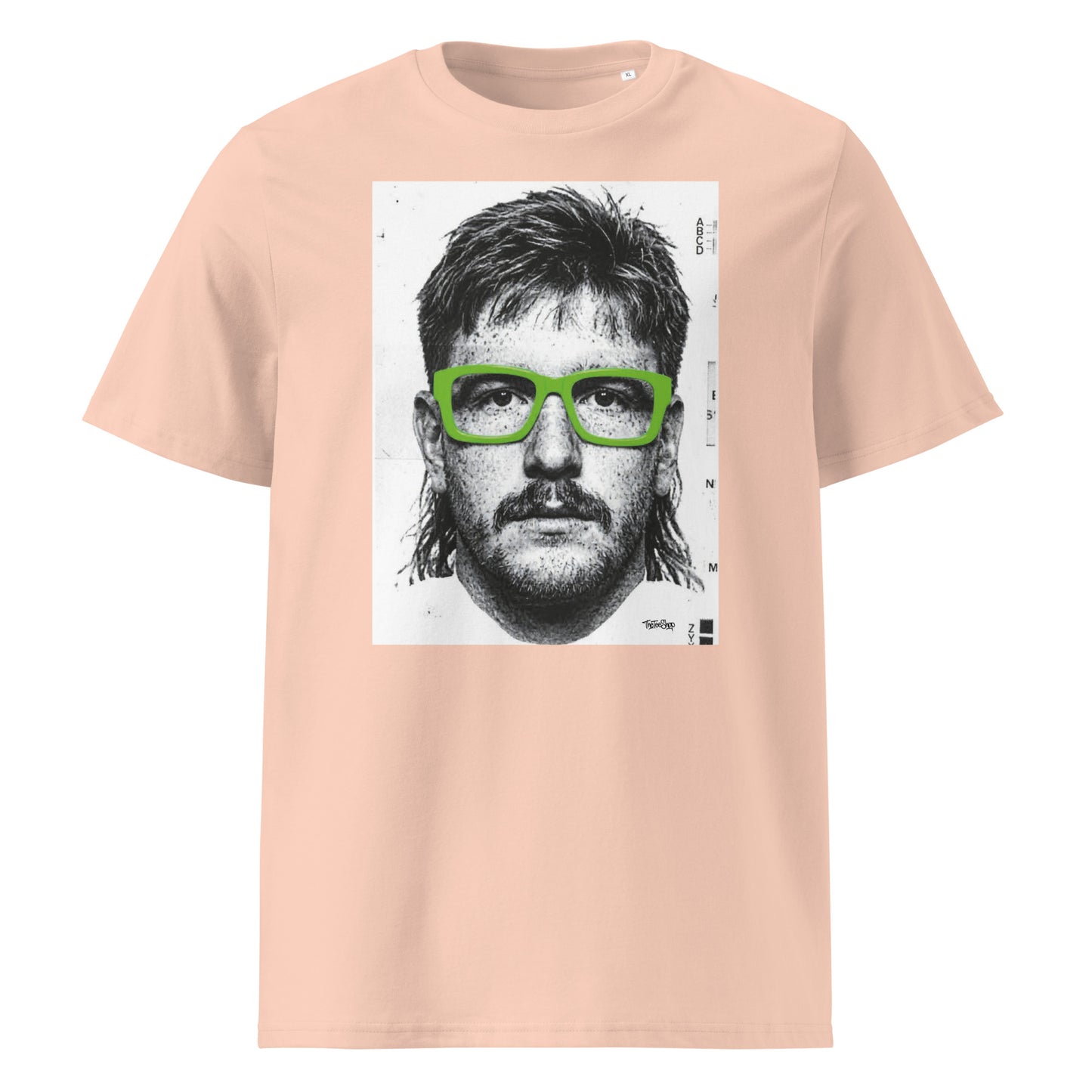 Peche t-shirt front view featuring an illustrated portrait inspired by a modern rugby lock wearing bold green glasses with a “what you looking at?” expression