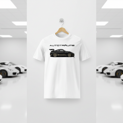 White AUTOTRÄUME GT3 T‑shirt with a black Porsche‑style car and gold highlights illustration hanging on a premium wooden hanger and silver wall peg against a central white wall in a bright sports car gallery, with a glossy white floor and blurred white and silver sports cars running down both sides.