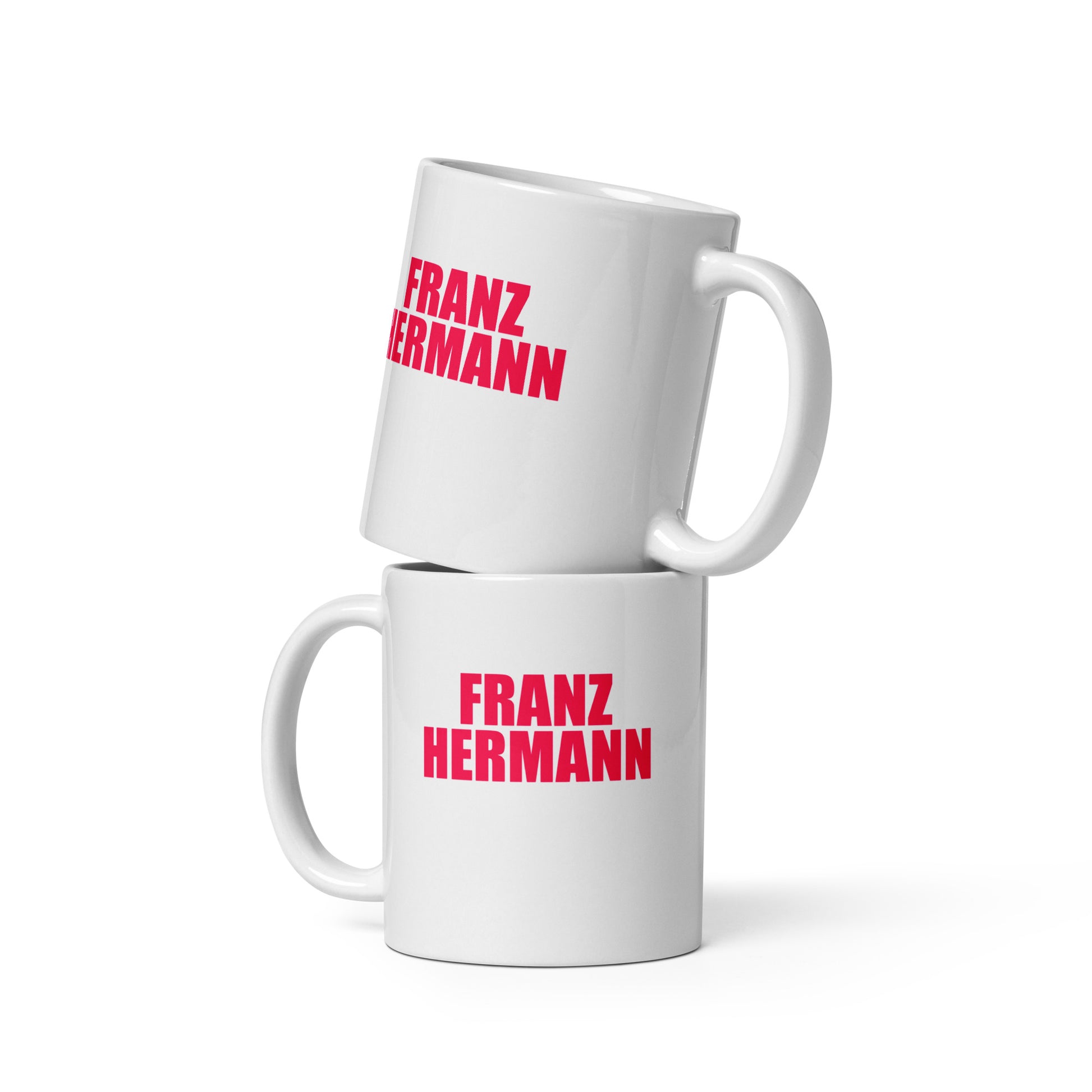 Front view of the Franz Hermann Mug in white, featuring bold RedBull pink lettering and a tribute to Verstappen’s Ferrari GT3 run. This 11oz mug is ideal for your morning coffee or pre race tea.